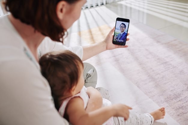 A mother is holding her baby during a telehealth appointment. The doctor is providing guidance on newborn care, and the mother is attentively listening and asking questions. The setting is a cozy nursery at home.