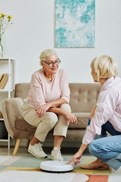 An elderly woman is performing a balance exercise prescribed by her physical therapist, who is monitoring her remotely through a tablet. The woman is using a walker for support.