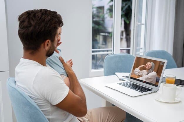 A speech therapist is demonstrating a tongue exercise to a patient through a video call on a laptop. The patient is mirroring the exercise, receiving real-time feedback from the therapist.