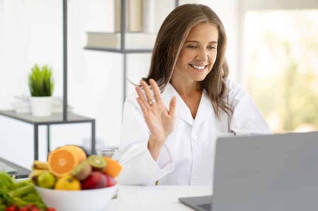 A close-up shot of a female registered dietitian smiling warmly while conducting a telehealth nutrition consultation. She is sitting in a well-lit office, with a laptop in front of her and a notepad beside it. The focus is on her friendly and approachable demeanor, creating a sense of trust and connection with the viewer.