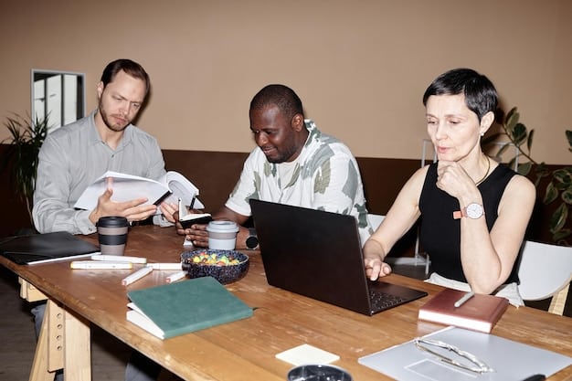 A photo showcasing a diverse group of individuals brainstorming around a table in a modern co-working space, with medical devices and prototypes displayed on shelves in the background, illustrating the collaborative environment of a MedTech accelerator.