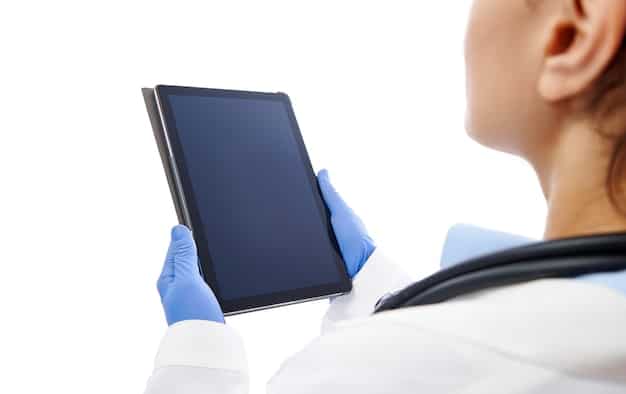 A close-up shot of a medical professional using a tablet displaying AI-enhanced medical imaging analysis software, highlighting the precise and detailed diagnostic capabilities of the technology, surrounded by modern medical equipment and a clean, sterile environment.