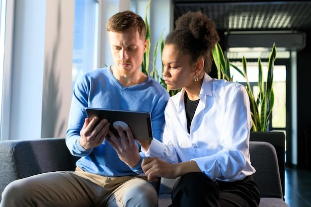 A healthcare provider using a tablet to securely share patient data with another provider, showcasing improved care coordination through technology.