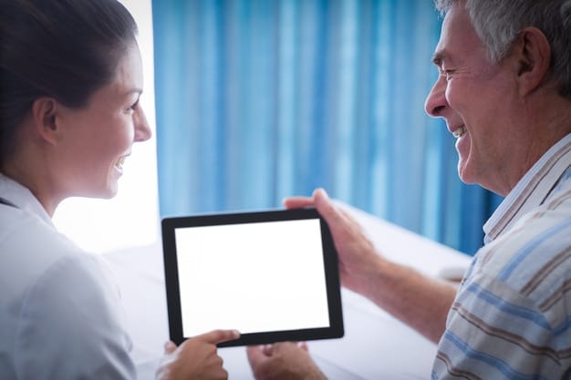 A doctor using a tablet to consult with a patient, showcasing telehealth and technology used to improve coordination of care and communication between providers.